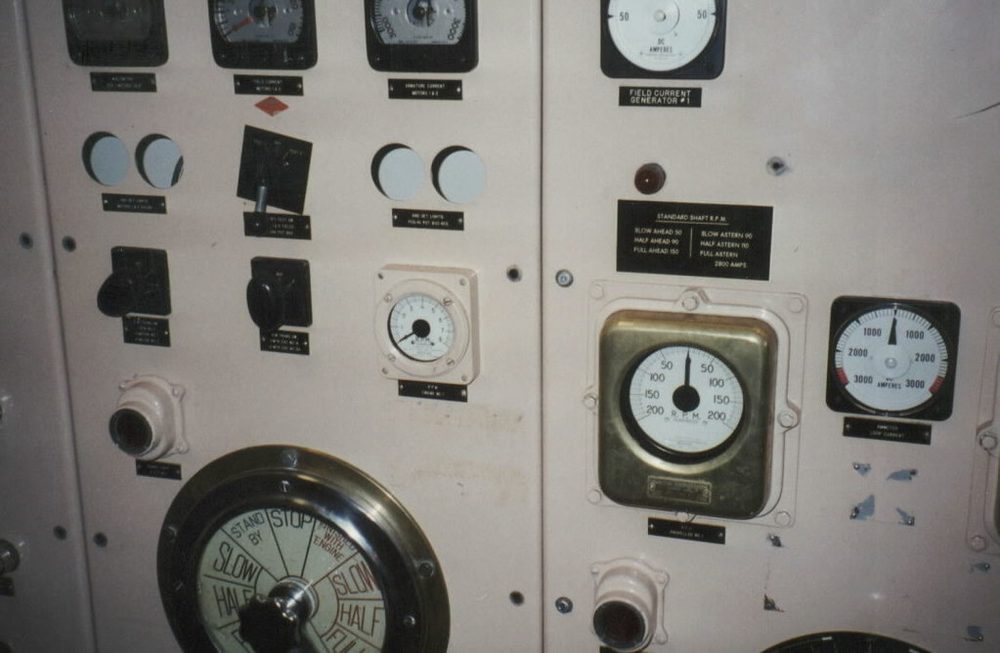 An industrial control panel of switches and dials